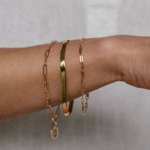 Variety of gold bracelets.