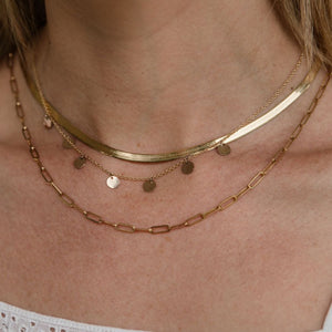 Variety of liquid gold necklaces on ladies neck