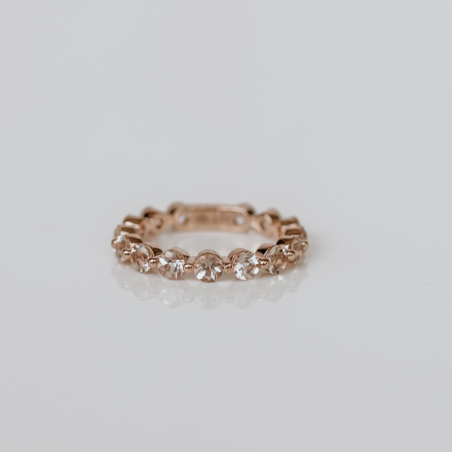 18ct rose gold bobble eternity ring with 15 3mm morganite stones.