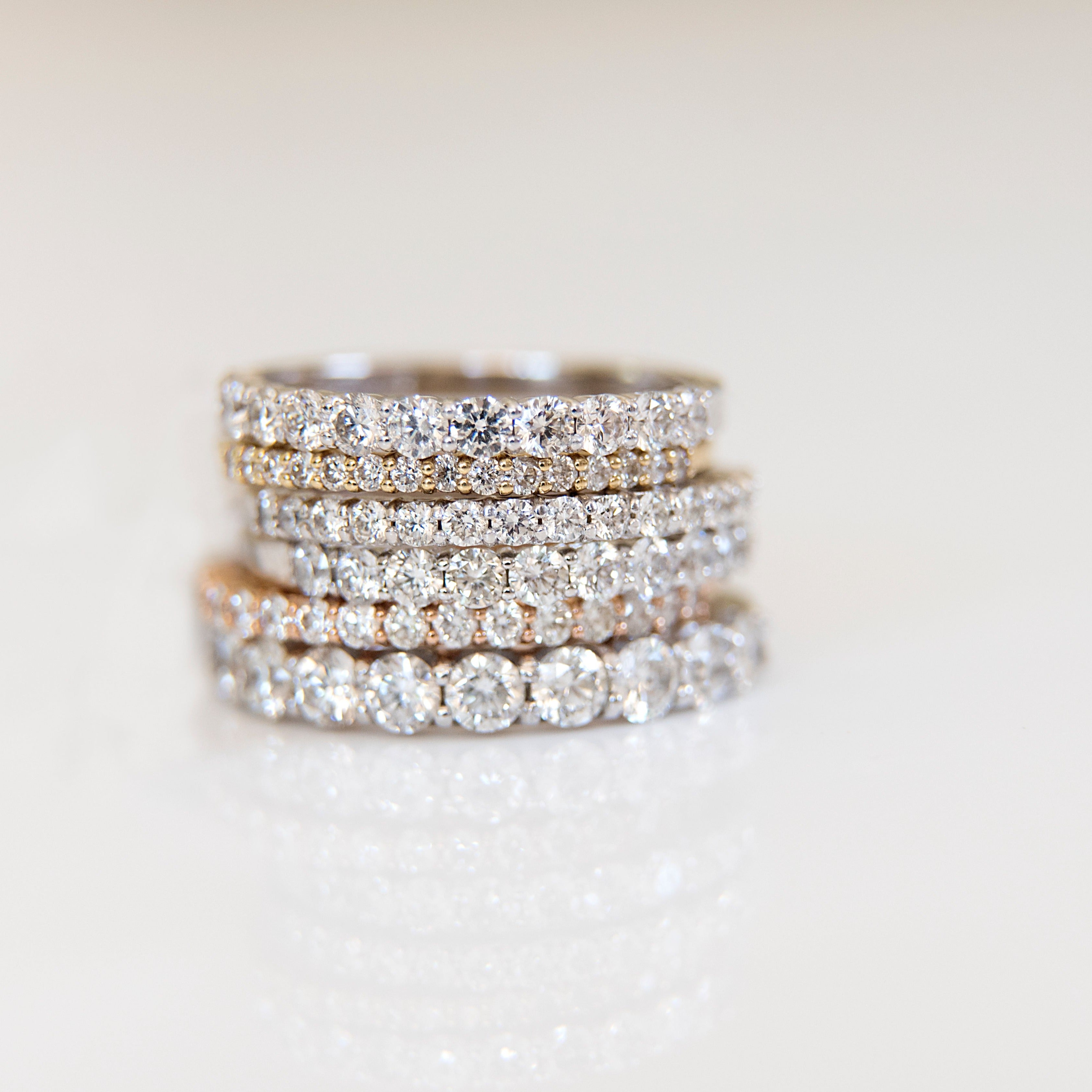 Stack of various sized diamond eternity bands.