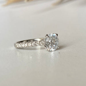 18ct white gold solitaire ring with 1.53ct brilliant cut diamond. The 4 claws are petal shaped and diamond encrusted. 