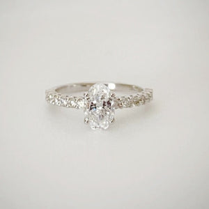 18ct white gold solitaire ring with 1ct oval cut diamond as the centre stone with 0.30ct diamond band.