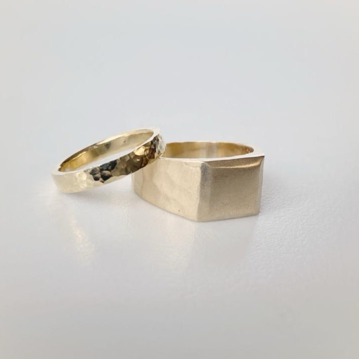 8ct yellow gold band with a hammered technique for her and a 18ct yellow gold band with a sand blasted technique for him