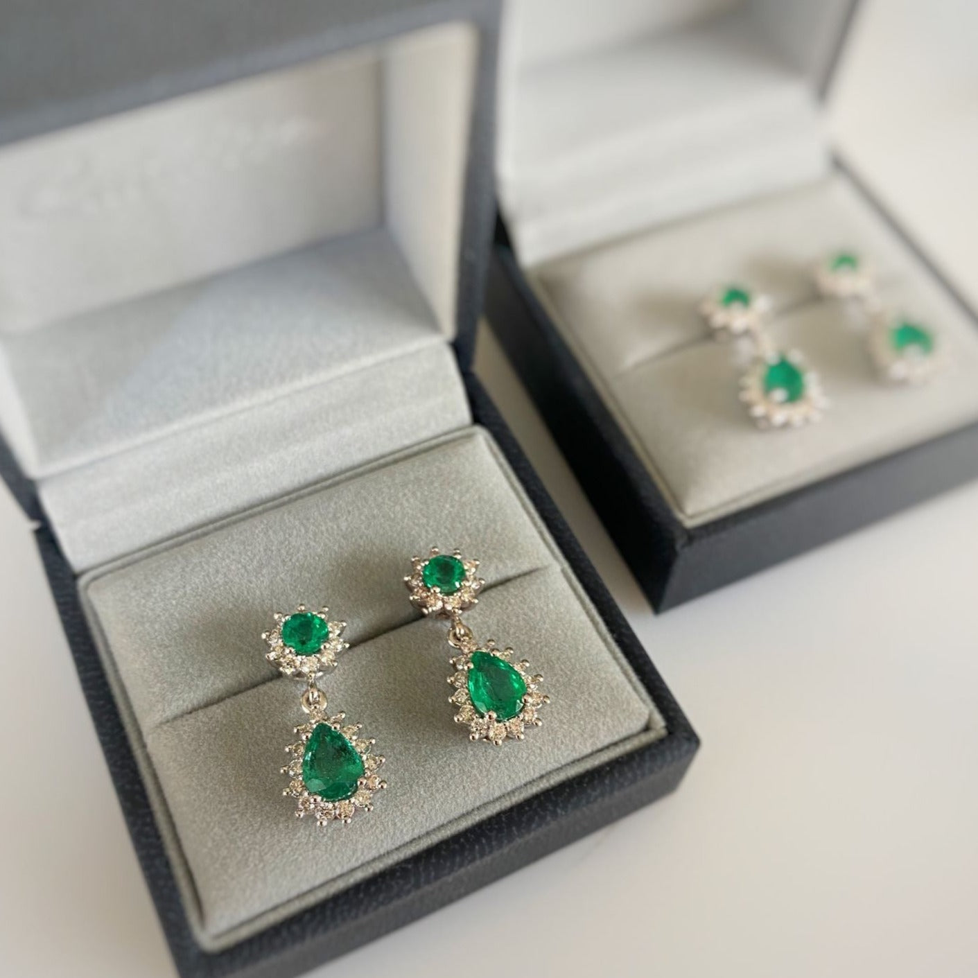 emerald and diamond earrings in earring jewellery box