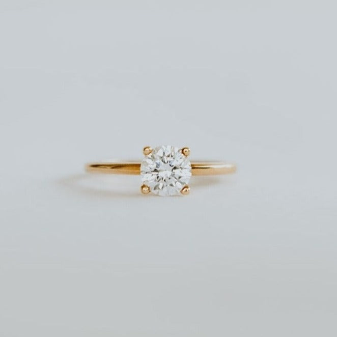 18ct rose gold solitaire ring with 0.80ct brilliant cut diamond. The heavily rounded skinny band, measuring 1.5mm