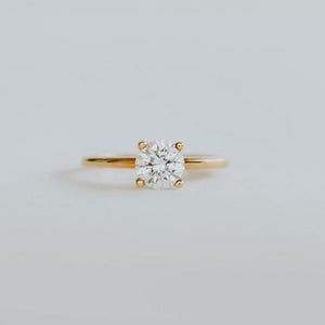 18ct rose gold solitaire ring with 0.80ct brilliant cut diamond. The heavily rounded skinny band, measuring 1.5mm