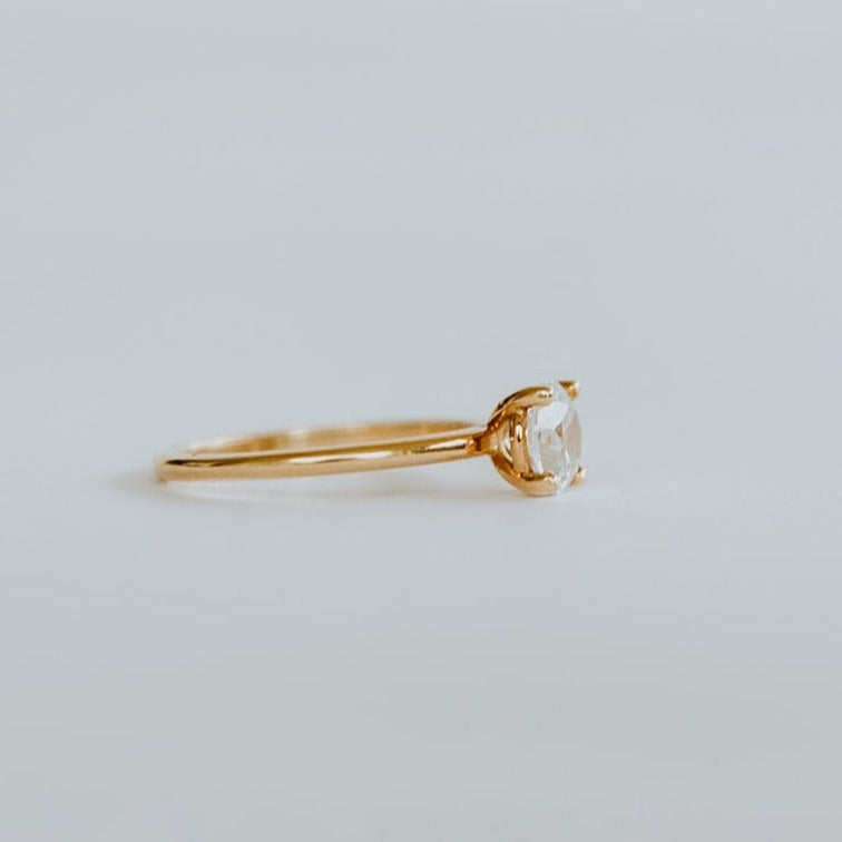 side view of 18ct rose gold solitaire ring with 0.80ct brilliant cut diamond. The heavily rounded skinny band, measuring 1.5mm