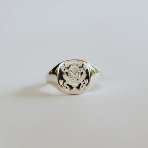 gents silver cushion cut signet ring with personalised engraved crest.